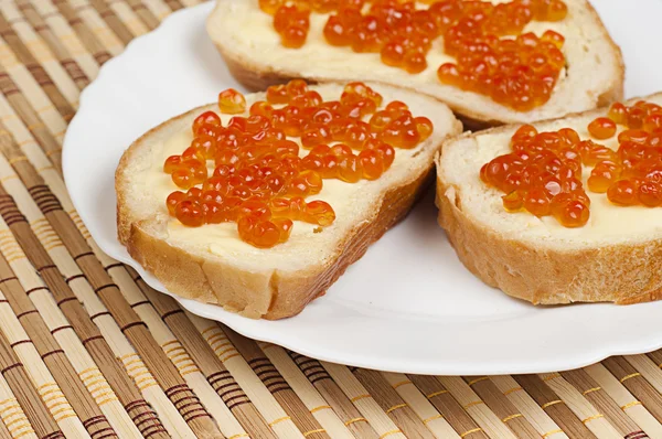 stock image Bread, butter and red caviar