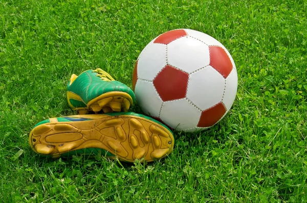 Ball and cleats — Stock Photo, Image