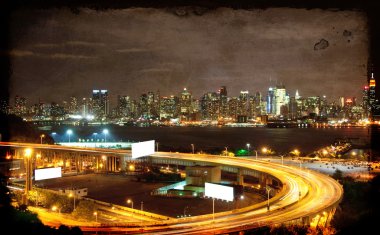 Vibrant night time nyc cityscape,advert space clipart