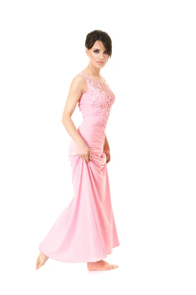 在粉红色的裙子美丽的女人 — 图库照片