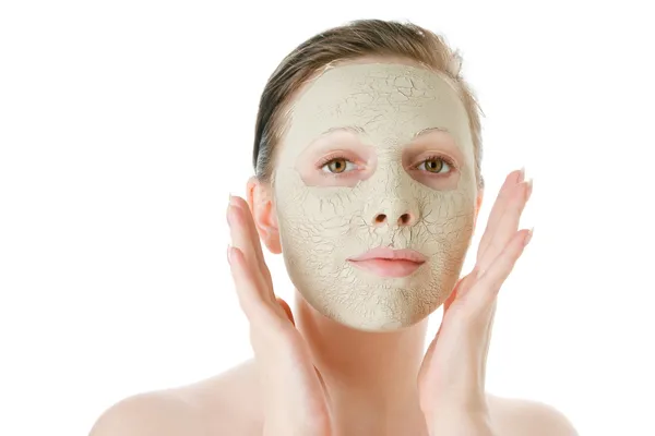 Krásná žena s obličejovou maskou — Stock fotografie