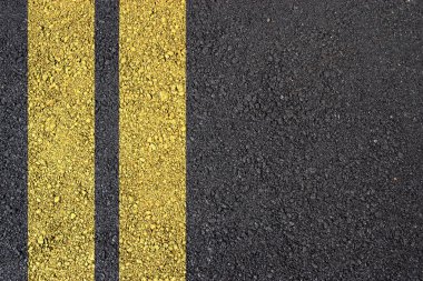 Asphalt surface with yellow line clipart