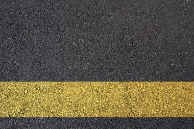 Asphalt surface with yellow line clipart