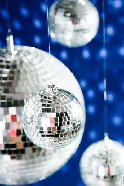 Mirrored disco balls with light spots over background — Stock Photo, Image