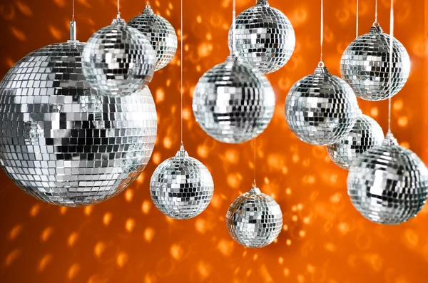 Mirrored disco balls with light spots over background — Stock Photo, Image