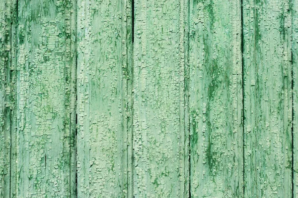 Gamla väderbitna träplankor textur målad grön — Stockfoto