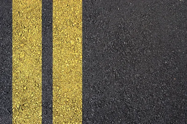 Asphalt surface with yellow line — Stock Photo, Image