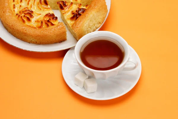 Stock image Delicious cheese pie with cut a piece of cake and black tea