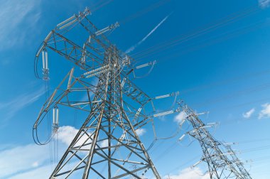 A line of electrical transmission towers carrying high voltage lines. clipart