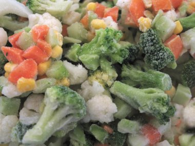 Frozen vegetables in macro close up. clipart