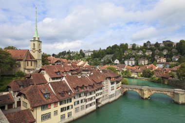 Bridge over Aare river and colorful town houses in Bern's Old Town district, Switzerland clipart