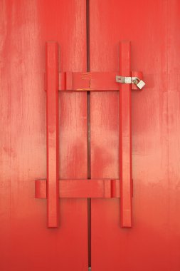 Red door of church with wood latch clipart