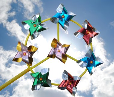 Pinwheel on sky and clouds clipart