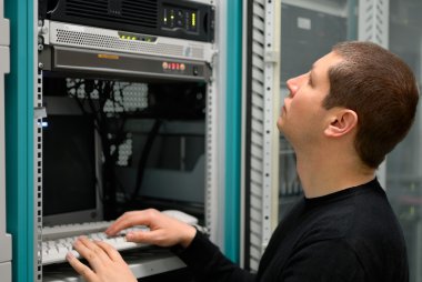 Network technician perform preventive maintenance to a server clipart