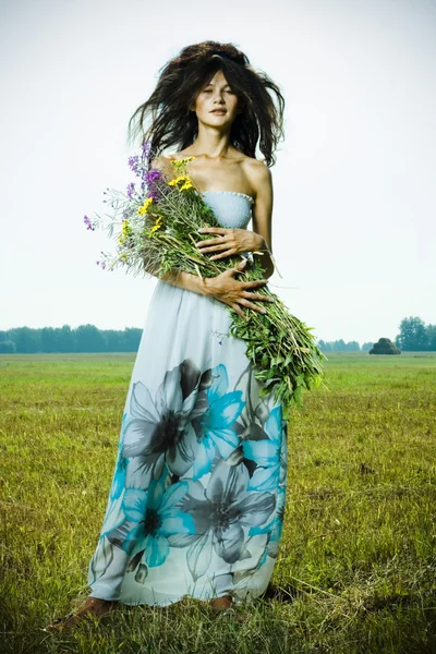 Portrait of beautiful girl in green field — Stock Photo, Image