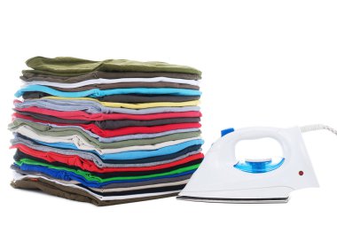 T-shirts in a pile and electric iron clipart