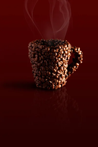 Taza en los granos de café — Foto de Stock