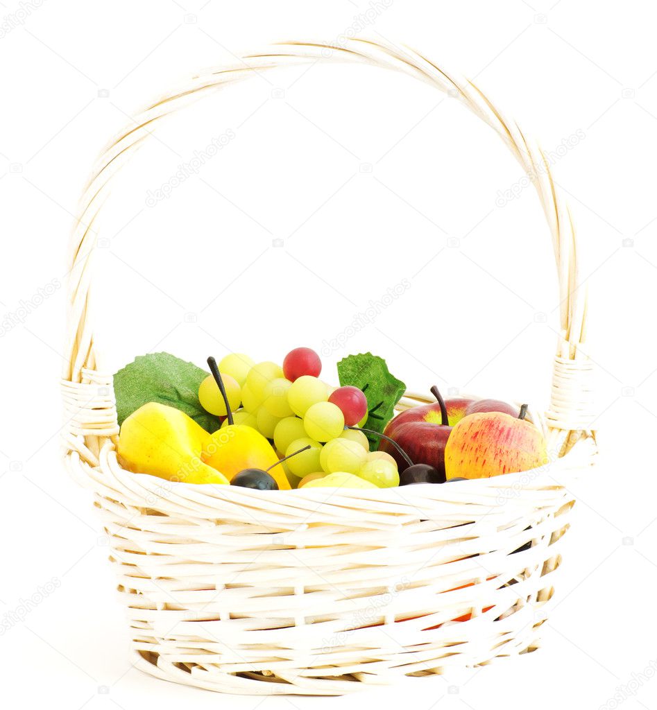 White basket with fruits isolated on white