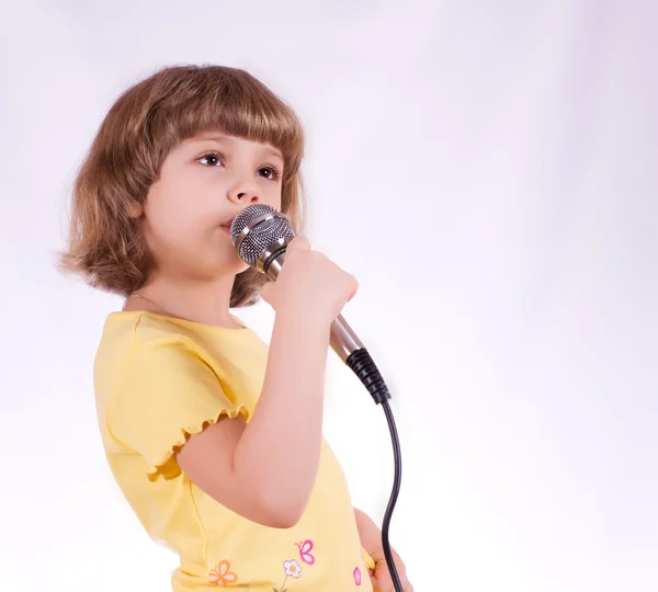 Jolie Petite Fille Avec Microphone Karaoké Photo De Stock