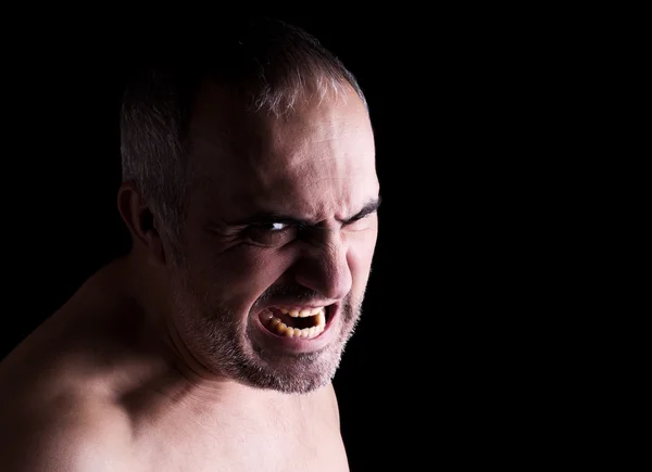 Stock image Portrait of a screaming mad man, isolated on black