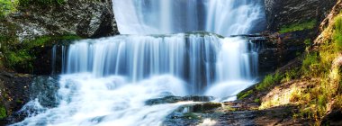 Waterfall panorama in Autumn clipart