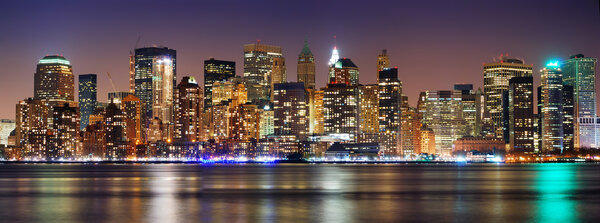 New York City night panorama with Manhattan Skyline over Hudson River with reflection.