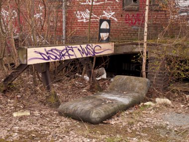 Mattress in front of a railroad terminus clipart