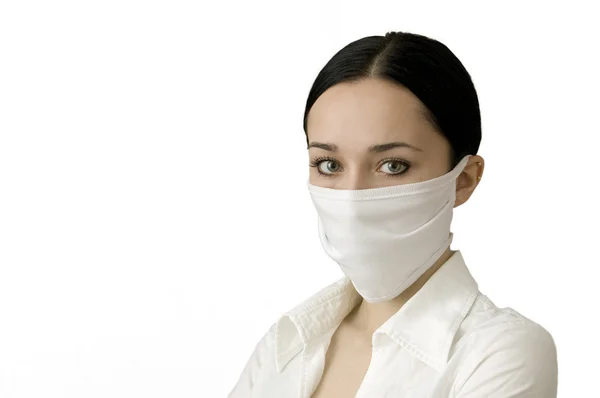 The beautiful women in a medical mask — Stock Photo, Image