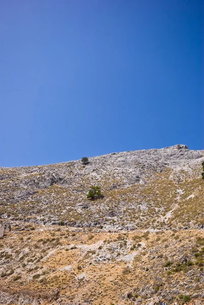 stock image Arid mountain and a blue sky