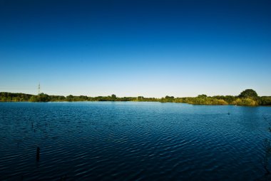 Lake and blue sky clipart