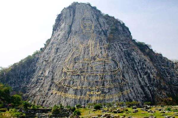 Golden Buddha on cliff — Stock Photo, Image