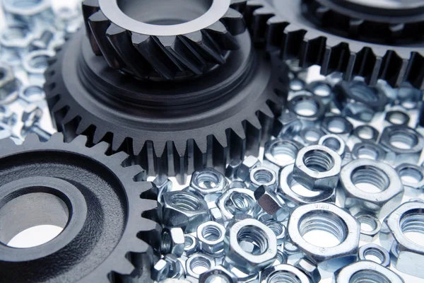 Cogs and nuts — Stock Photo, Image