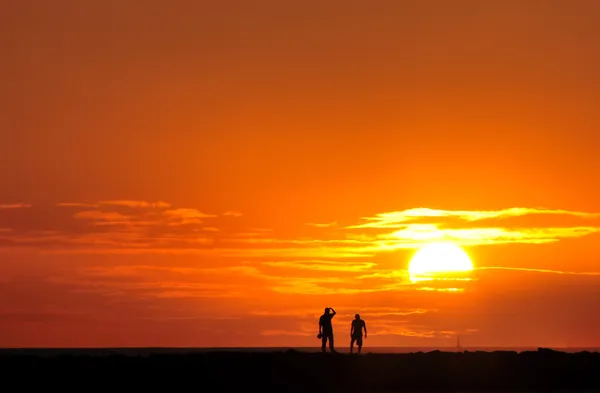 Захід сонця на пляжі Стокове Зображення