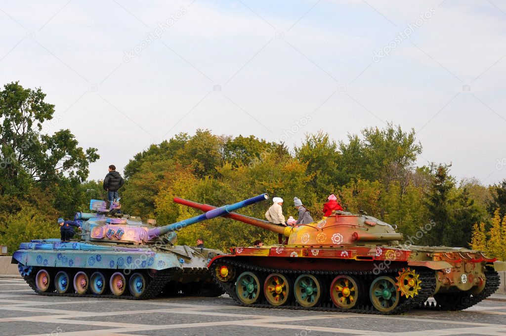 Military tank painted in colorful flowers