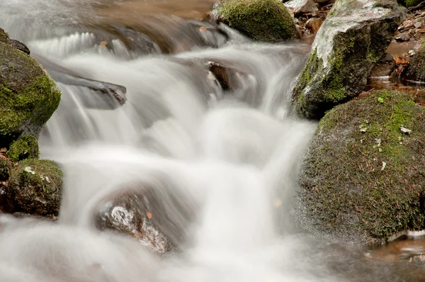 Water flowing over rocks Stock Image