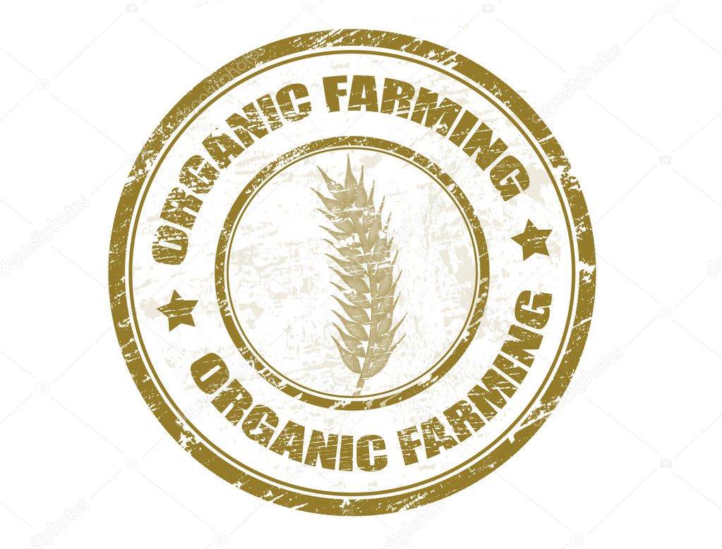 Grunge rubber stamp with wheat symbol and the text organic farming written inside