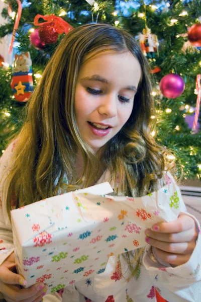 Christmas girl opening presents — Stock Photo, Image
