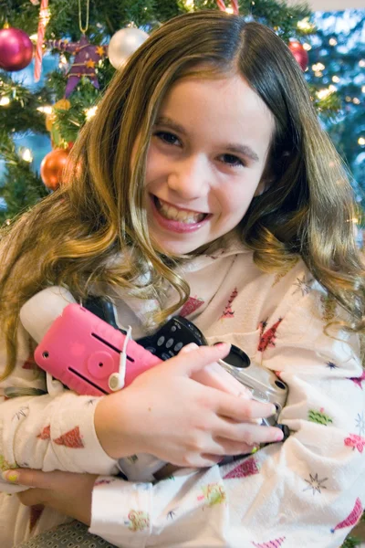 Christmas girl opening electronic presents — Stock Photo, Image