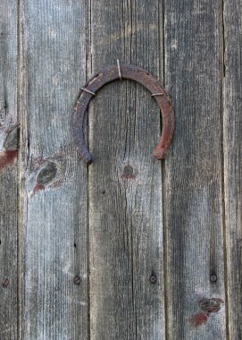 Lucky horseshoe on barn door clipart