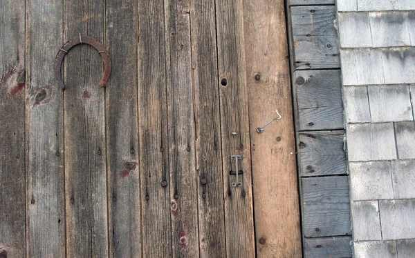 stock image Lucky horseshoe nailed to barn door at farm