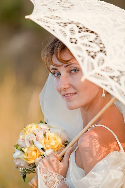 Bride with umbrella Royalty Free Stock Photos