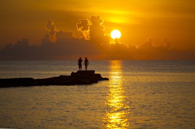 A couple in love together at sunset clipart