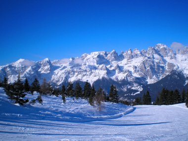 Ski slope in dolomites of brenta clipart