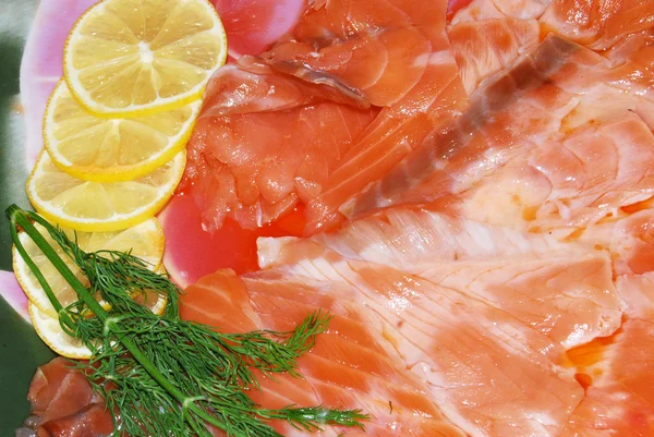 Stock image The salmon with lemon, are cut by slices