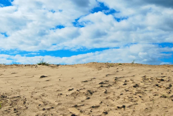 stock image Deserted landscape: sand and the is bright-blue sky