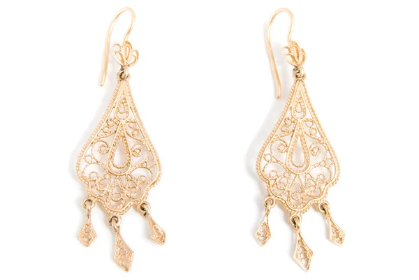 Graceful gold earrings — Stock Photo, Image