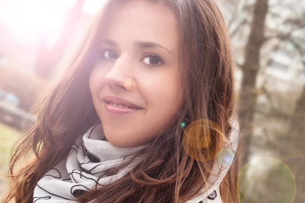 Young charming brunette at the park — Stock Photo, Image