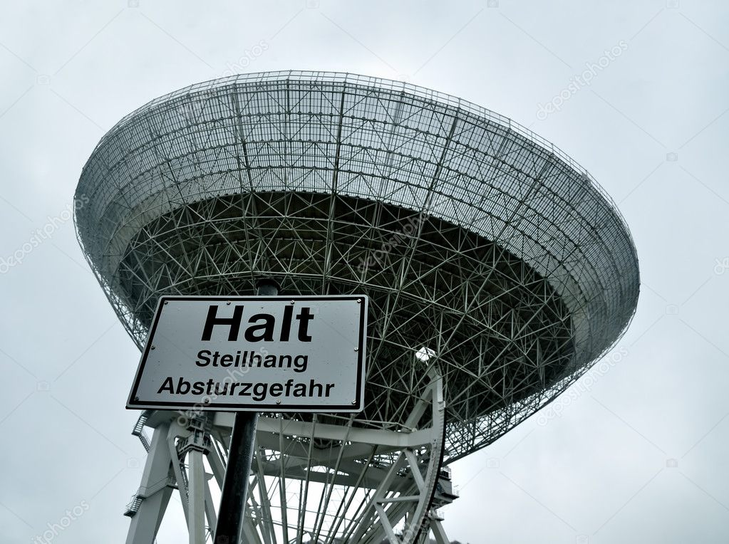 Radio telescope, radar in astronomical observatory with Stop sign.