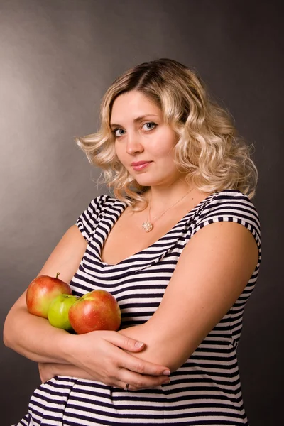 stock image Portrait of beautiful young pregnant woman of blonde. She sits on a chair a