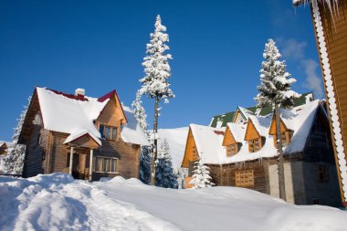 Snow-covered house is in Carpathian Mountains, Ukraine, Dragodra clipart